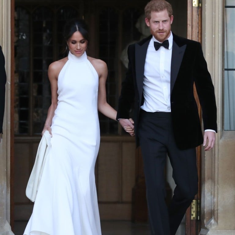 The newly married Prince Harry, Duke of Sussex (right), and Meghan Markle, Duchess of Sussex, wearing a Stella McCartney dress, leave Windsor Castle after their wedding to attend an evening reception at Frogmore House. Photo: AFP
