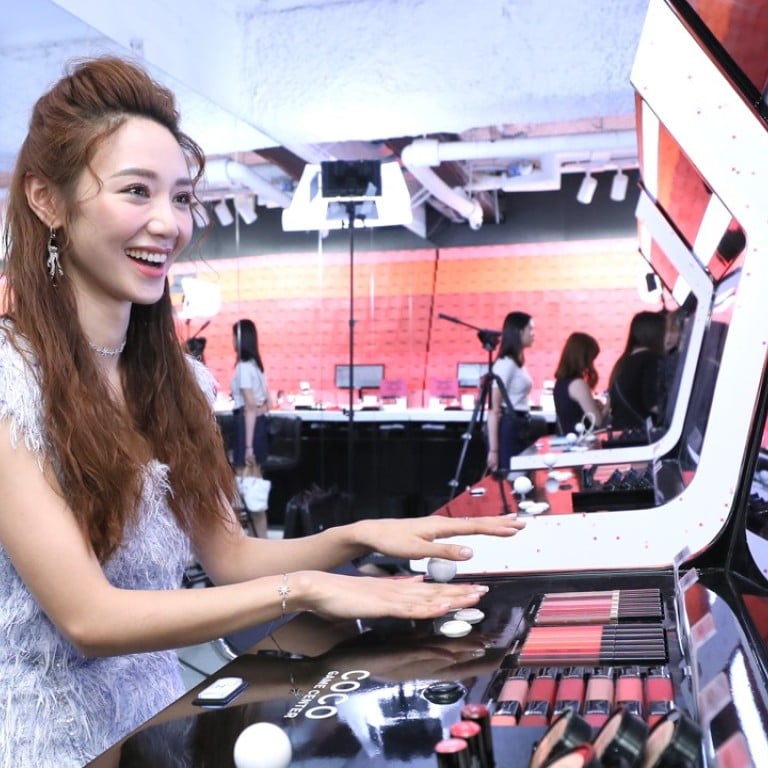 Elva Ni enjoying the arcade games at Chanel's Coco Game Center