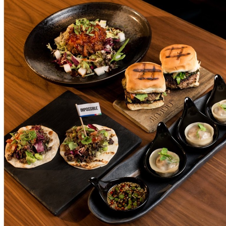 Korean delights, including tacos, bulgogi sliders and steamed dumplings, served at JINJUU, in Lan Kwai Fong Central – all with the Impossible plant-based meat alternative.