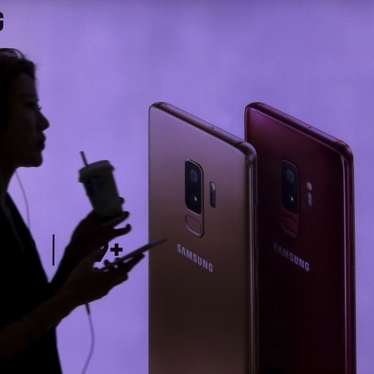 A woman passes by an advertisement for Samsung's Galaxy S9 and S9+ smartphone at a subway station in Seoul, South Korea. Photo: Ahn Young-joon/ AP