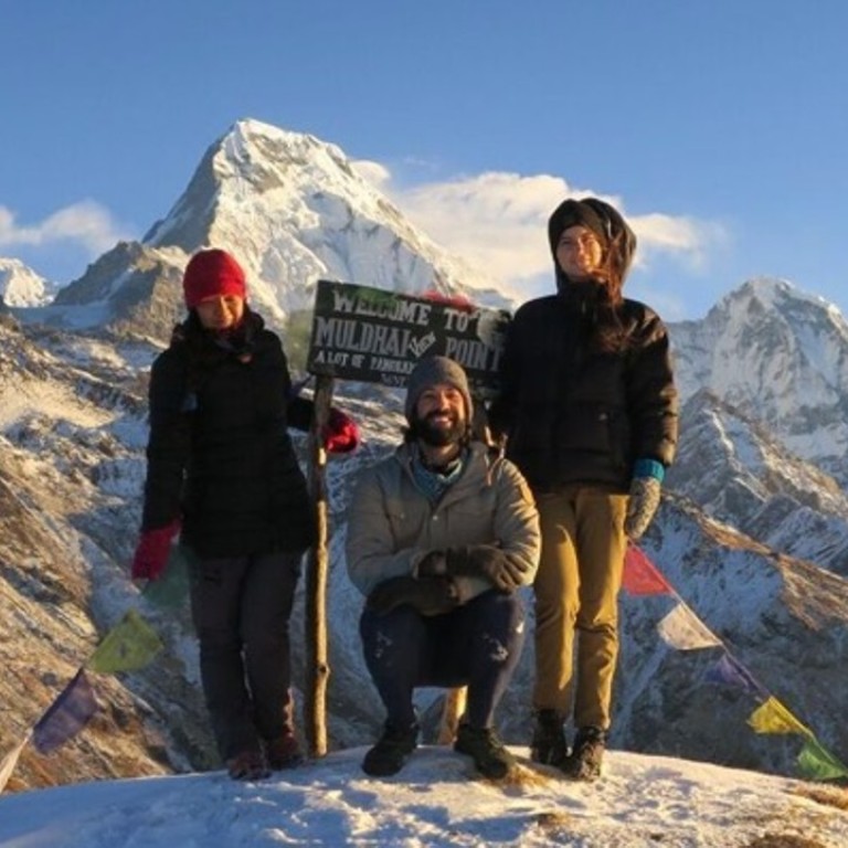 Kate Parrish (far right) and her husband, Kyle (centre), with their Sherpa guide, Kamala, while trekking in the Annapurna mountains of Nepal while on their 15-month round-the-world trip. Photo: Kyle and Kate Parrish