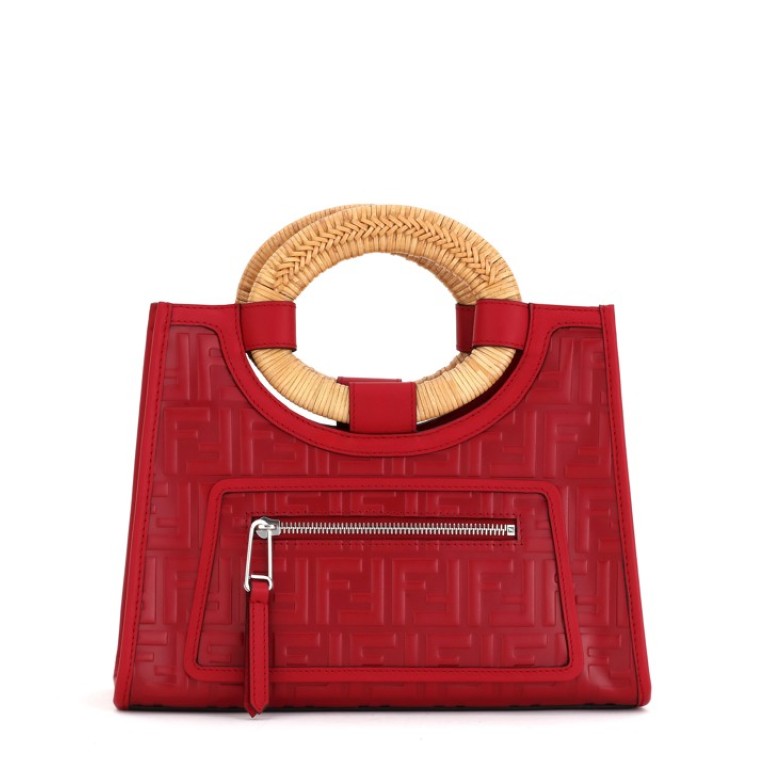 Fendi. The Mini Runaway bag in red calfskin has raised FF motifs over the entire surface and a rigid oval double handle in woven rattan, HK$19,800