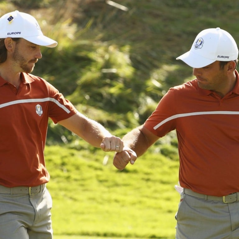 Tommy Fleetwood of Europe and Francesco Molinari of Europe celebrate during the 2018 Ryder Cup in Paris. Loro Piana designed a fast-drying, short-sleeved polo shirt made from techno-dry cotton for the team. Photo: Getty Images