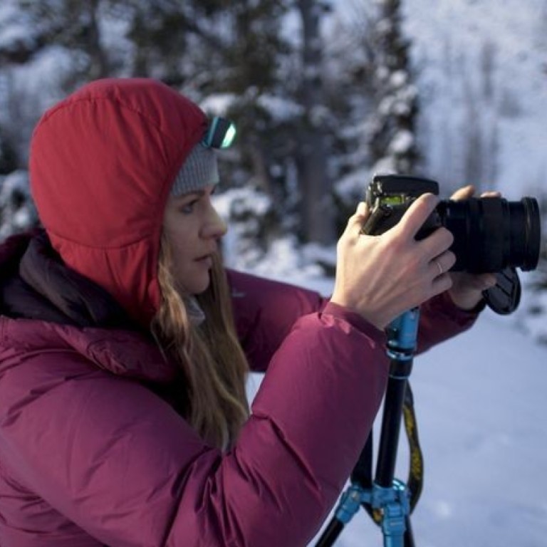 Meghan Young, who opted to become a professional Instagram influencer rather than work as a lawyer, photographs a winter landscape during a hike in Cascade Mountains in the US state of Washington. Source: Bloomberg