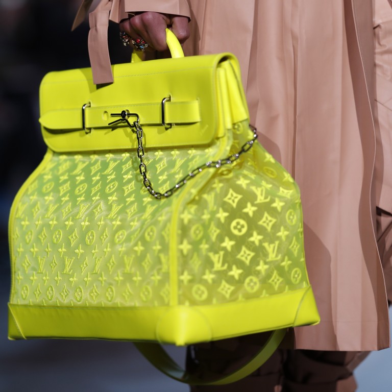 A model heading off on his travels with a Vuitton bag wearing a safari hat and a quasi-military camel suit art at Paris men’s fashion week. Photo: EPA-EFE