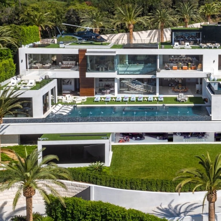 The Bel Air mansion in Los Angeles – complete with a decorative real-life helicopter on the roof – is unsold after two years on the market and its original US$250 million asking price has now been cut by US$100 million. Photo: Berlyn Photography