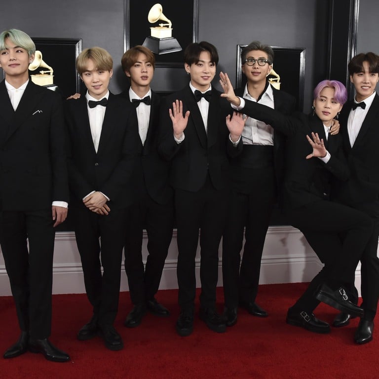 The seven members of K-pop boy band BTS, all dressed in tuxedos, arrive at Sunday’s 61st annual Grammy Awards in Los Angeles. Photo: Invision/AP