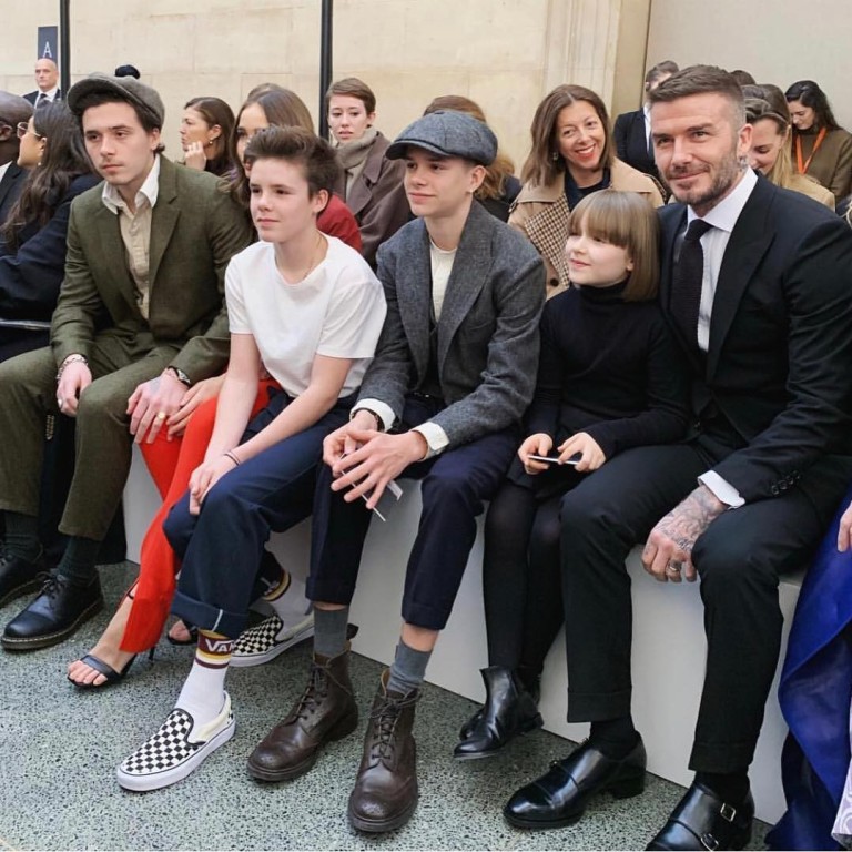 David Beckham reveals secret handbag at son Brooklyn's wedding