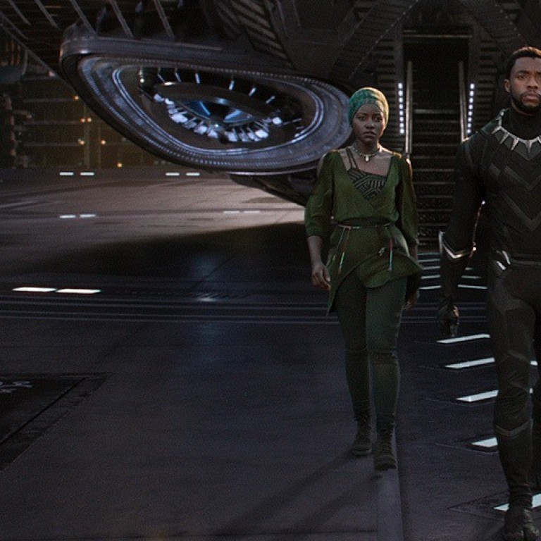 Actor Chadwick Boseman (centre) as T’Challa, the king of the fictitious African nation of Wakanda, who becomes superhero Black Panther, in a scene from the film, ‘Black Panther’. Photo: Disney/TNS