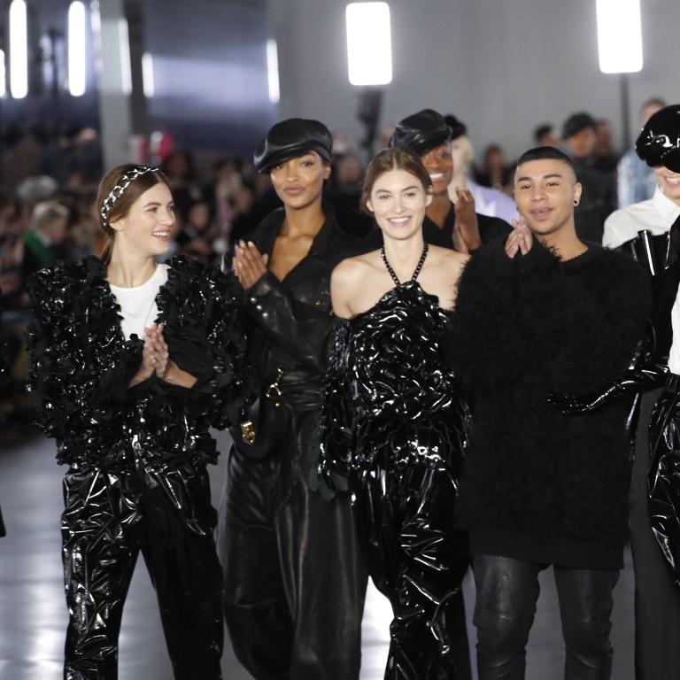 Designer Olivier Rousteing (centre) poses with models after Balmain’s ready to wear autumn/winter 2019-2020 collection in Paris on Friday. Photo: AP