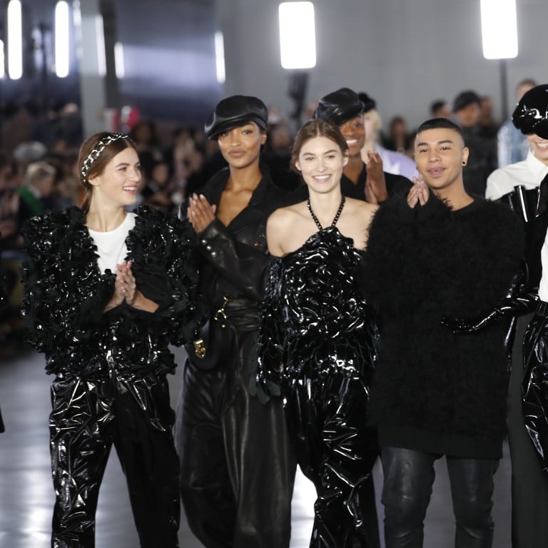 Designer Olivier Rousteing (centre) poses with models after Balmain’s ready to wear autumn/winter 2019-2020 collection in Paris on Friday. Photo: AP