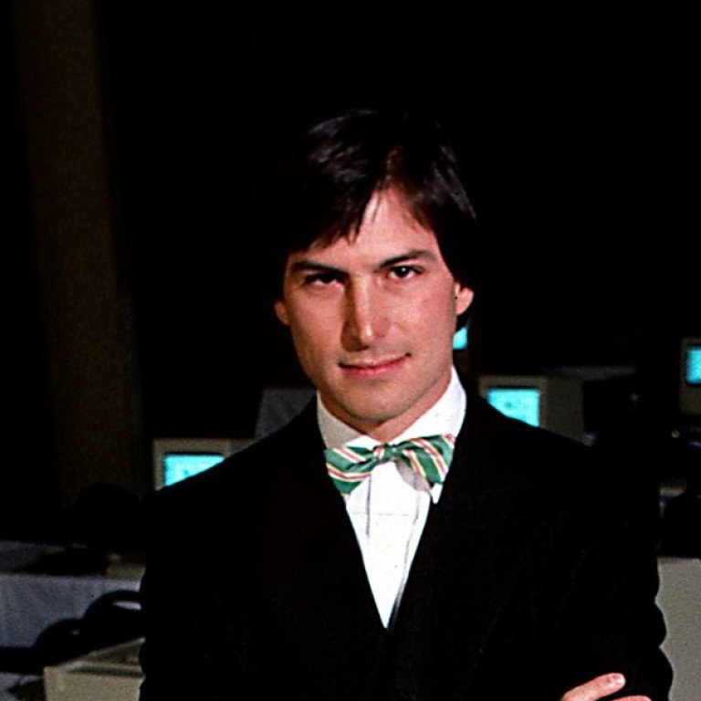 Steve Jobs, the late Apple CEO, surrounded by early Macintosh computers in 1984. Photo: Business Insider