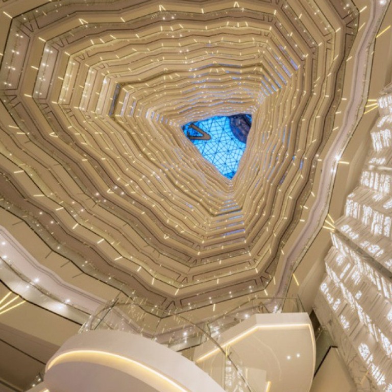 The lobby, looking up towards the sky-lit atrium, at the Four Seasons Hotel Guangzhou, situated on the top 30 floors of Guangzhou International Finance Centre.