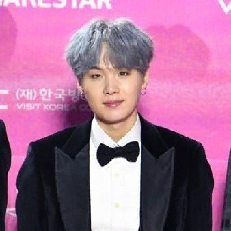 Suga, a member of the K-pop boy band BTS, has marked his 26th birthday by donating nearly US$90,000 and more than 300 dolls to child cancer patients in South Korea. Photo: Yonhap