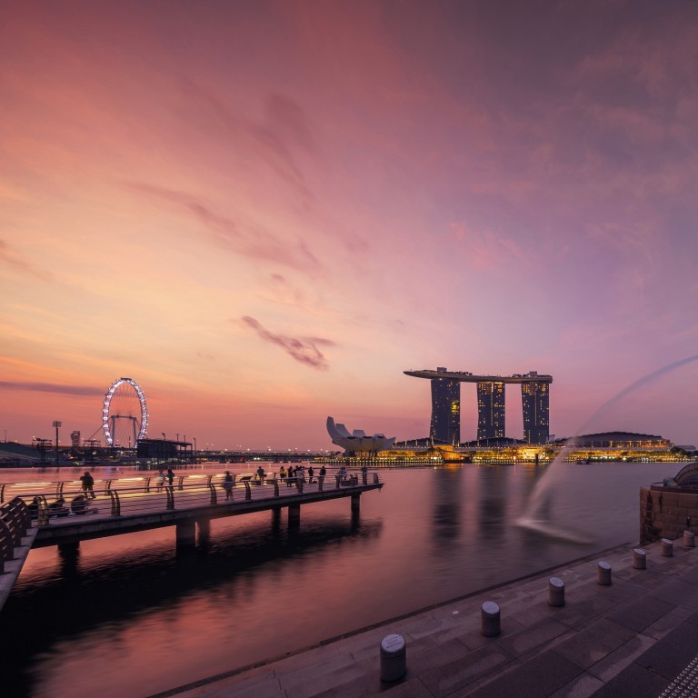 Sunset over the Merlion, the official mascot of the city state of Singapore, which is one of the world’s top three preferred ‘homes’ for wealthy people with fortunes of more than US$30 million.