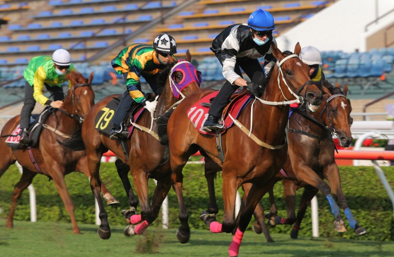 Exultant (black and white silks) leads home stablemate Furore (blue, yellow and green) in a trial at Sha Tin on Tuesday morning. Photos: Kenneth Chan