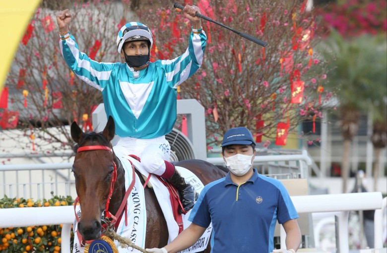 Karis Teetan celebrate the win of Romantic Warrior in the Classic Mile at Sha Tin. Photo: HKJC