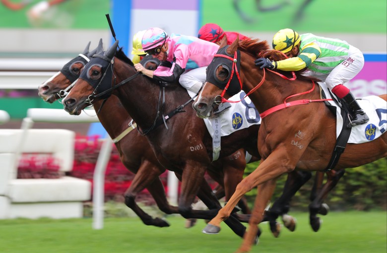 Beluga (pink and blue cap) wins under Zac Purton in November. Photo: Kenneth Chan