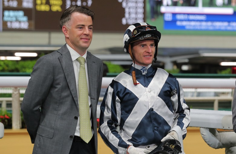 Jamie Richards and Zac Purton celebrate Australian import Magniac’s first Hong Kong win at Happy Valley on April 19. Photo: Kenneth Chan