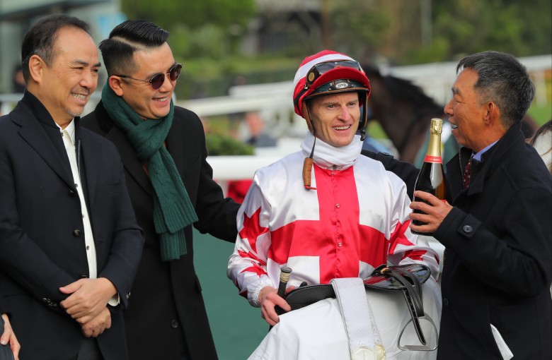 Pierre Ng celebrates the win of Fighting Machine at Sha Tin on Saturday with Zac Purton and connections. Photos: Kenneth Chan