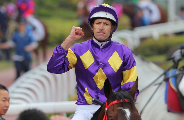 Hugh Bowman celebrates after winning the Classic Cup aboard Helios Express. Photo: Kenneth Chan