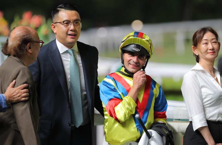 Pierre Ng celebrates with jockey Andrea Atzeni and connections of Robot Knight. Photos: Kenneth Chan