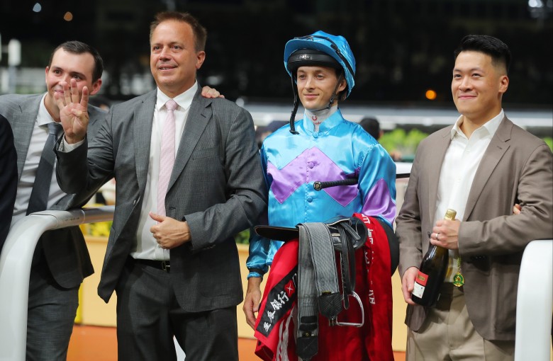 Trainer Caspar Fownes (second from left) celebrates his Happy Valley four-timer with son Ronan (left), jockey Harry Bentley and connections of Lo Rider. Photos: Kenneth Chan