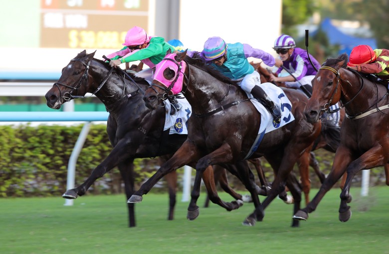 Kempes (pink cap) and Andrea Atzeni fly home to win at Sha Tin. Photos: Kenneth Chan