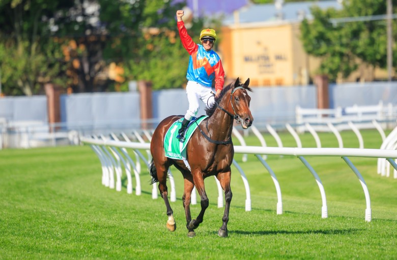 A euphoric Zac Purton punches the air after winning The Everest aboard Ka Ying Rising. Photos: HKJC