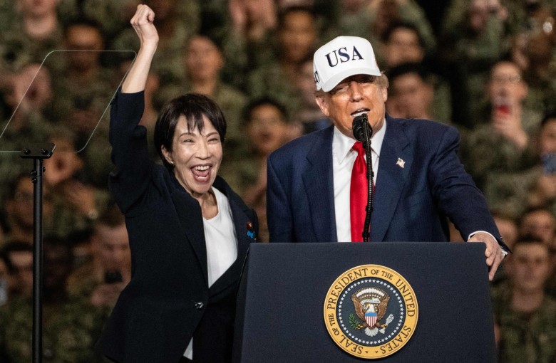 Japan’s Prime Minister Sanae Takaichi (left) gestures as US President Donald Trump delivers a speech in front of US Navy personnel on board the US Navy’s USS George Washington aircraft carrier at the US naval base in Yokosuka, Japan, on October 28. Photo: AFP
