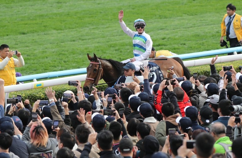 Jockey Zac Purton salutes the Sha Tin crowd after booting home Voyage Bubble in the Group One Hong Kong Sprint. Photos: Kenneth Chan