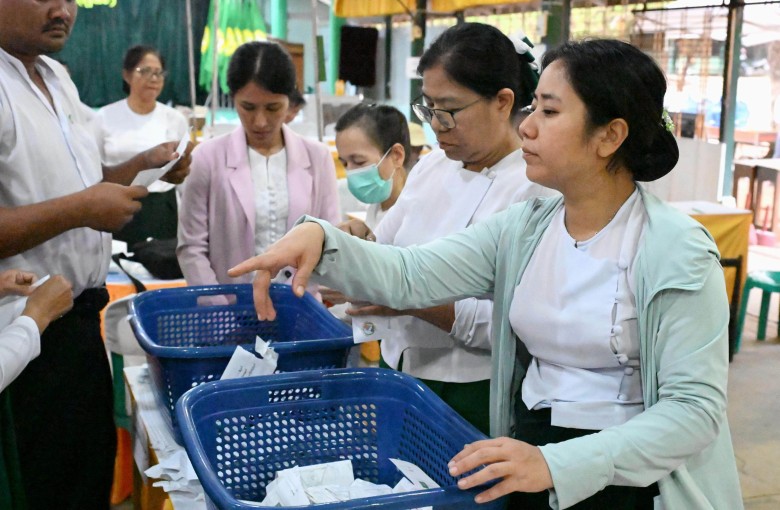 Vote counting takes place on January 25 in Yangon for Myanmar’s general election. Photo: Kyodo