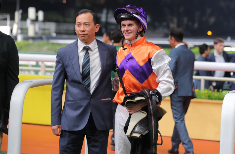 Jockey Ethan Brown celebrates his first Hong Kong win with trainer Cody Mo. Photos: Kenneth Chan