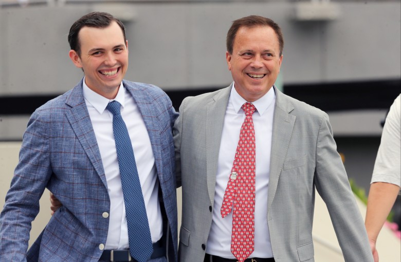 Caspar Fownes (right) and son Ronan celebrate the stable’s double at Sha Tin on Sunday. Photos: Kenneth Chan