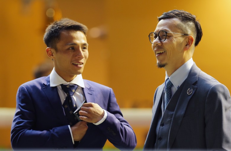 Frankie Lor (right) and his new apprentice Alfred Chan celebrate a winner on Wednesday night. Photos: Kenneth Chan