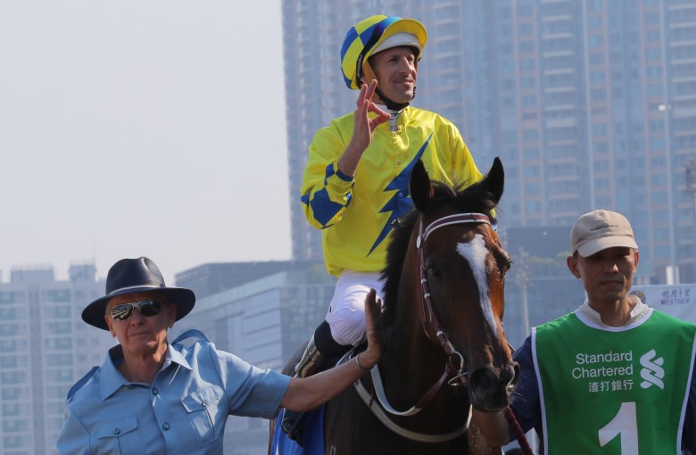 John Moore returns with jockey Hugh Bowman after winning the Champions & Chater Cup with Werther in 2017.