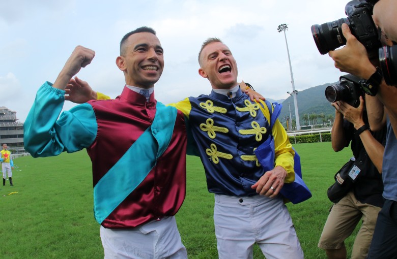 Jockeys Joao Moreira (left) and Zac Purton pose for photographers at the end of 2018-19 season. Photos: Kenneth Chan
