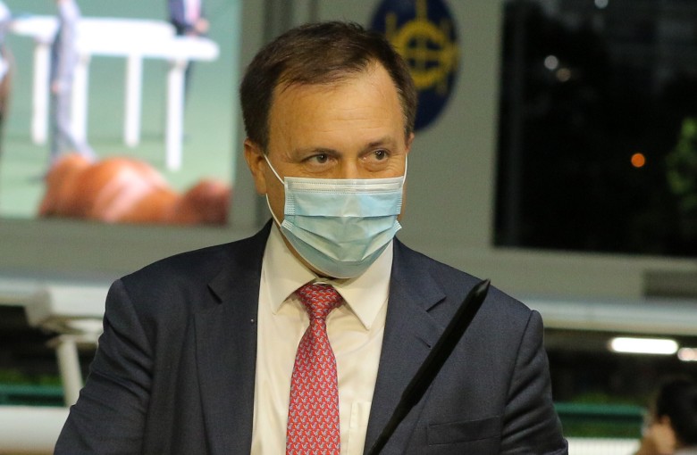 Trainer Caspar Fownes plays around with Joao Moreira’s whip after Green Luck’s win on Wednesday night. Photos: Kenneth Chan