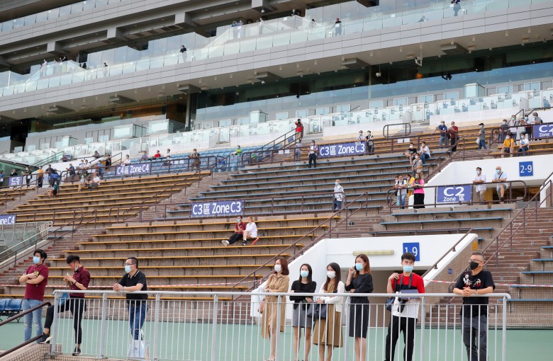 Fans in the stands enjoy the action at Sha Tin on Sunday. Photos: Kenneth Chan