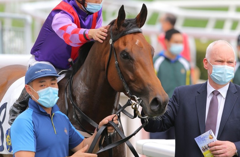 Race 2, Summit Cheers, ridden by Matthew Poon, won the class 4 over 1000m at Sha Tin. David Hall leading the horse. 28FEB21 SCMP / Kenneth Chan.