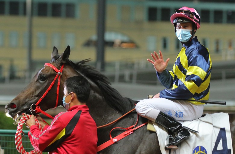 Zac Purton acknowledges his five winners after returning to scale aboard Wind N Grass. Photo: Kenneth Chan
