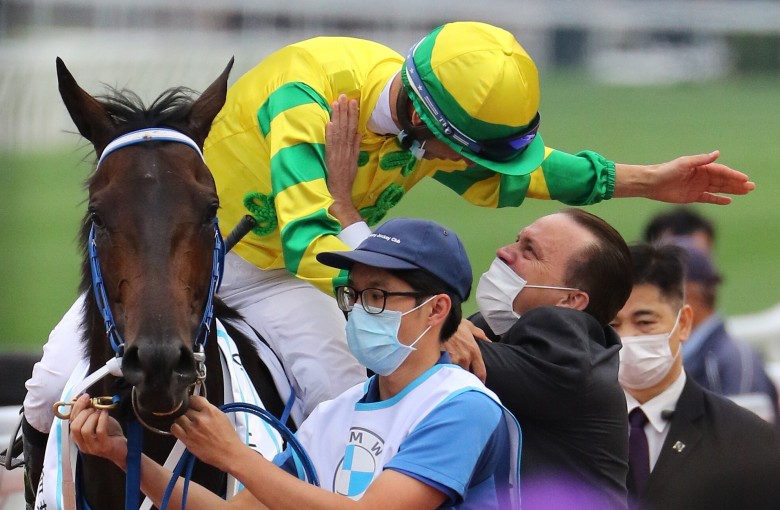 Caspar Fownes and Joao Moreira embrace after winning the BMW Hong Kong Derby with Sky Darci. Photos: Kenneth Chan