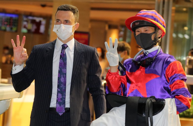 Douglas Whyte and Jerry Chau celebrate their trebles at Happy Valley on Wednesday night. Photo: Kenneth Chan