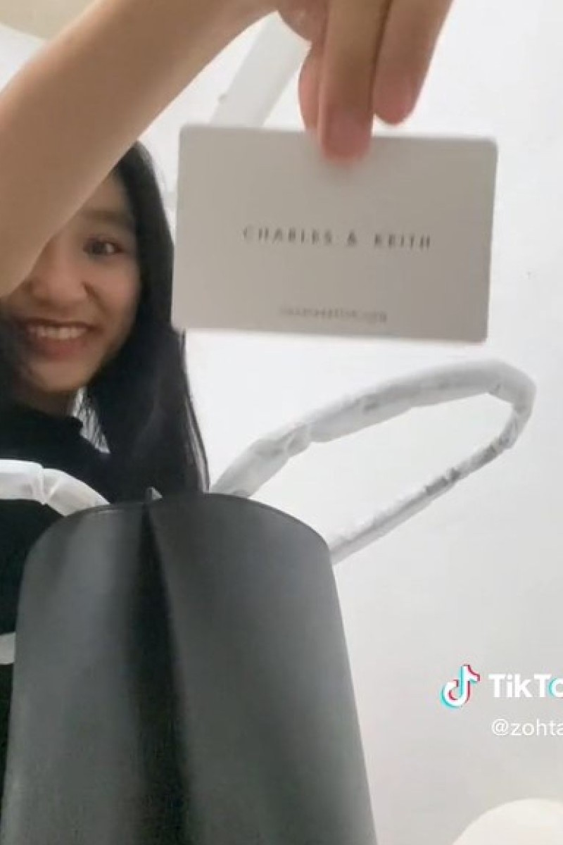Mean comments leave Singapore TikTok user in tears after she flaunted first  'luxury' Charles & Keith bag
