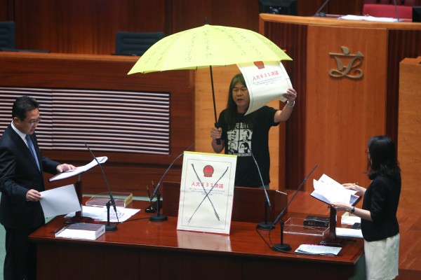 Moves such as raising an umbrella, carried out here by former legislator Leung Kwok-hung in 2016, during oath-taking is not acceptable, officials have warned. Photo: Dickson Lee
