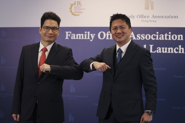 Joseph Chan Ho-lim, undersecretary for Financial services and the Treasury (left), and Kwan Chi-man, chairman of the Family Office Association Hong Kong, attend the association’s opening ceremony at the InvestHK office in Admiralty on November 18, 2020. Photo: Nora Tam
