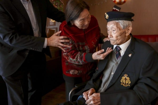 Yeung Ming-hon, 98, one of two remaining survivors of the Battle of Hong Kong, with his  his 92-year-old wife Yeung Yu Yee-fan at the Chinese Recreation Club in Tai Hang. Photo: Jonathan Wong