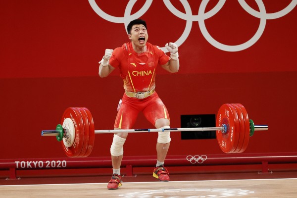 China’s Lijun Chen reacts after winning gold in the Men’s 67kg weightlifting event at the Tokyo 2020 Olympic Games. Photo: EPA-EFE