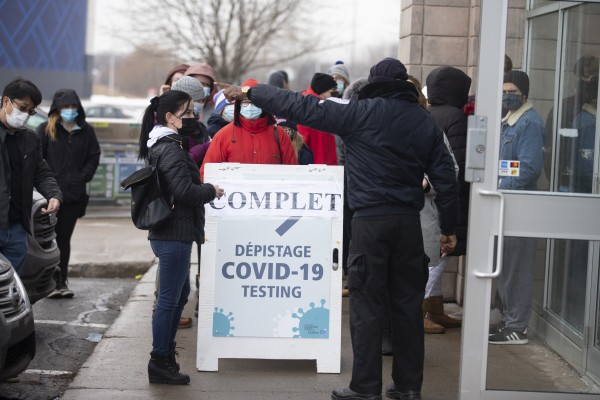 Residents wait in line outside a Covid-19 testing centre in Montreal, Quebec, in December. Photo: Bloomberg
