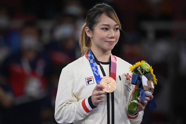 Hong Kong’s Grace Lau Mo-sheung after winning the Tokyo Olympic Games women’s individual kata bronze medal final event at the Nippon Budokan in Japan. Photo: AFP Hong Kong’s Grace Lau Mo-sheung after winning the Tokyo Olympic Games women’s individual kata bronze medal final event at the Nippon Budokan in Japan. Photo: AFP